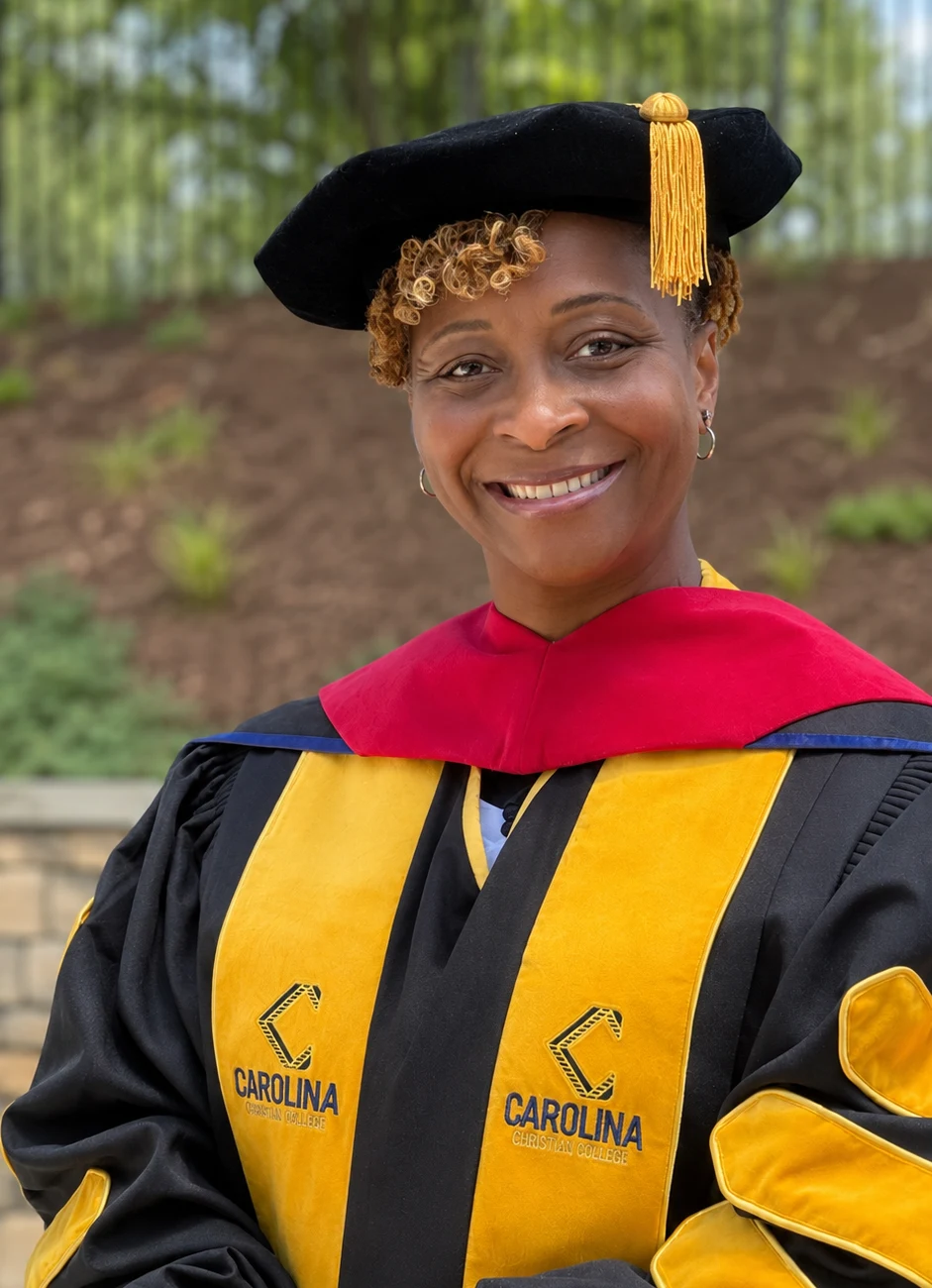 Dr. Alexis S. Smith in doctoral regalia at her May 2026 graduation